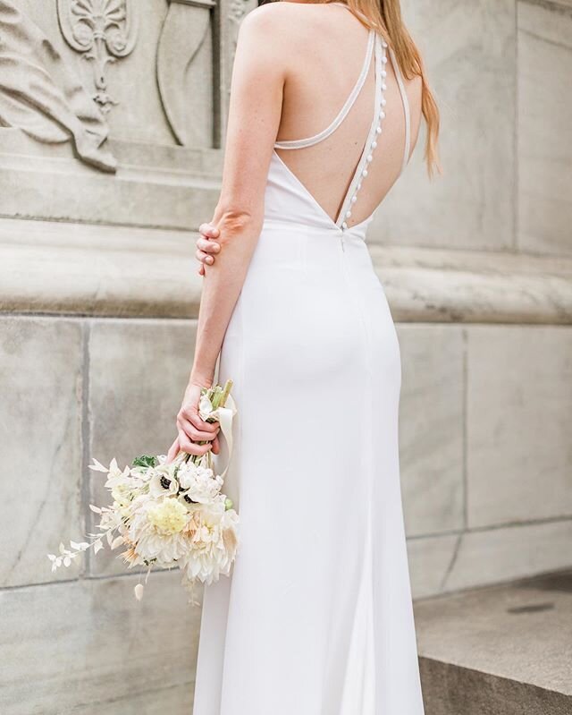 With the back on our silk crepe Clio gown, you&rsquo;d never think a minimalist gown wasn&rsquo;t memorable. .
.
.
Photo: @lovedanielleoh 
Model: @josefineesvensson 
Florals: @laurel.society 
#bridalbouquet #fallbride #nybride #coolbride #bohobride 
